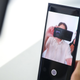 When taking a selfie, the portion of the screen hiding the front-facing camera turns black to improve image quality.